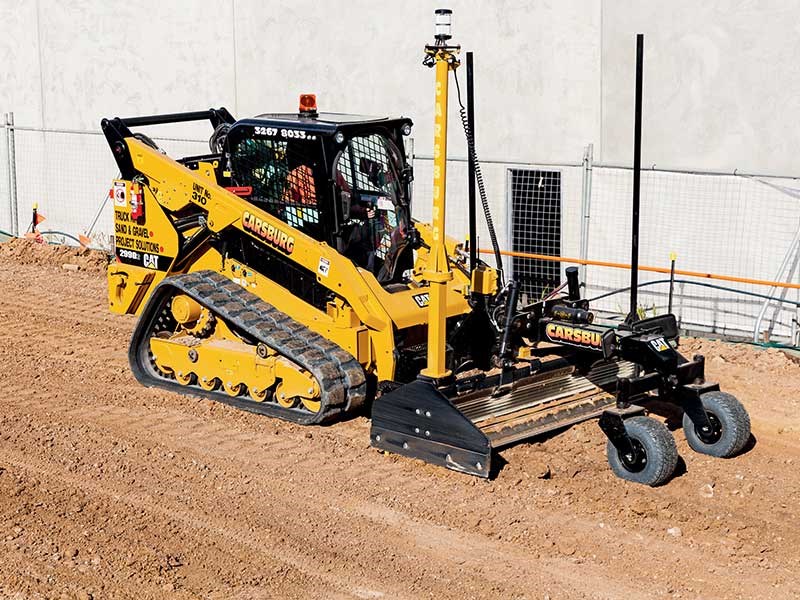 Cat 299D compact track loader and Box Blade attachment