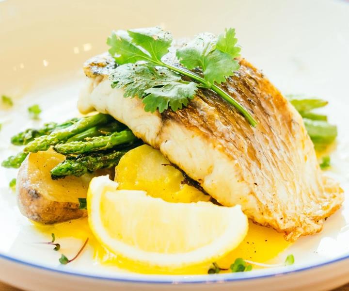 Buttery wild Barramundi with baby potatoes is just one of the delectable dishes to enjoy when you visit Airlie Beach.