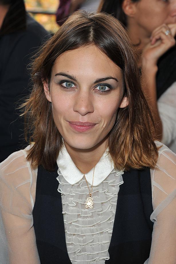 With shorter hair and her fringe tucked away in an off-centre part, Chung sits in the front row of Miu Miu’s SS12 show.