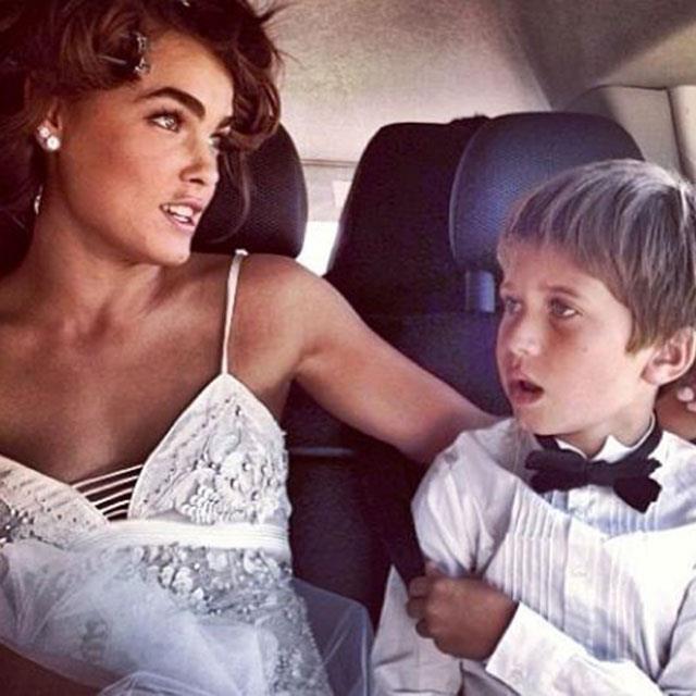 <strong>@bambilegit</strong><br> "EN ROUTE TO THE BIG DAY, WITH THE NUMBER ONE RING BOY," posted the bride, wearing Roberto Cavalli, as she snuggled up to Single's son Justice on the way to the ceremony.