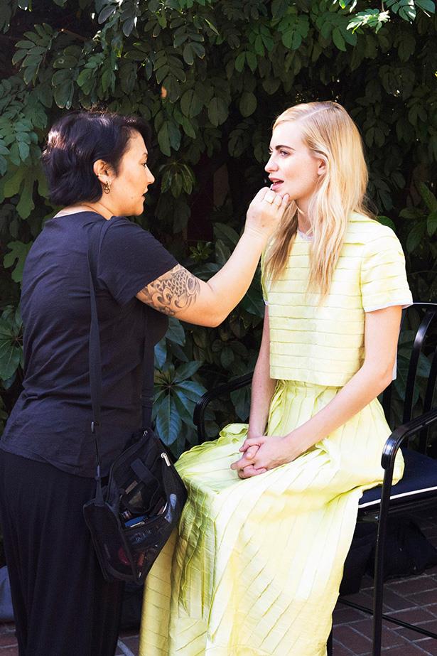 Delevingne pauses for a touch-up in Roksanda Ilincic's creation. "I researched some of my favourite red-carpet dresses [from the archives] and wanted to do something that was in keeping with my SS14 collection, says the designer. "The season was inspired by the work of the Brazilian artist Hélio Oiticica and his wonderful use of colour and texture. I love that the outfit is a top and skirt; it's a really versatile take on red-carpet dressing." Photo: Andi Elloway