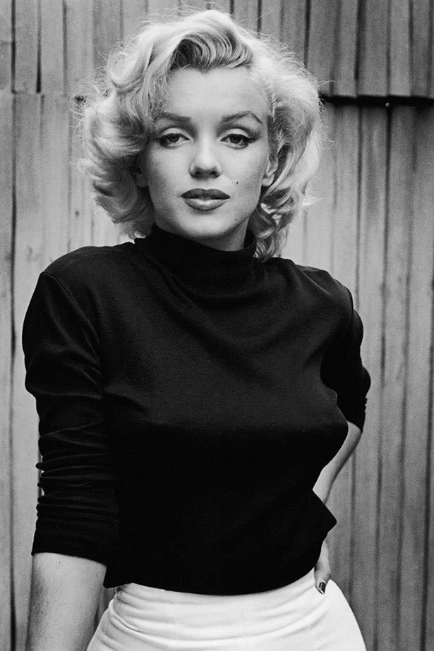 Those eyes. Marilyn poses on the porch of her house in 1953