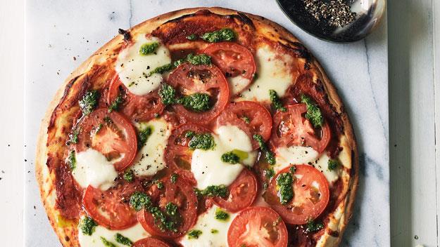 **[Tomato, pesto and bocconcini pizza](https://www.womensweeklyfood.com.au/recipes/tomato-pesto-and-bocconcini-pizza-14352|target="_blank")**