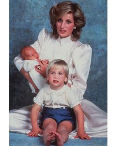 An early portrait of Diana, Princess of Wales, with sons Prince William, foreground, and Prince Harry.