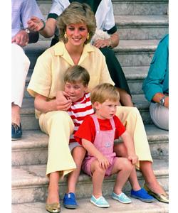 Always happy when near her sons, the Princess smiles as she sits with Harry, front, and William on the steps of the Royal Palace on the island of Majorca, Spain, in August 1987, where the British Royal family holidayed with the Spanish King, Juan Carlos.