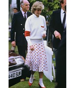 Proving that modern and classic do mix, this undated photograph shows the Princess with matching red dots on her skirt and socks at a polo match in Britain.