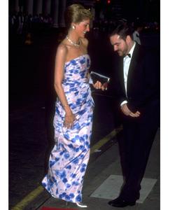 In keeping with her love of classically elegant design, the Princess often chose full-length gowns like this white and blue floral strapless dress, worn in July 1989.