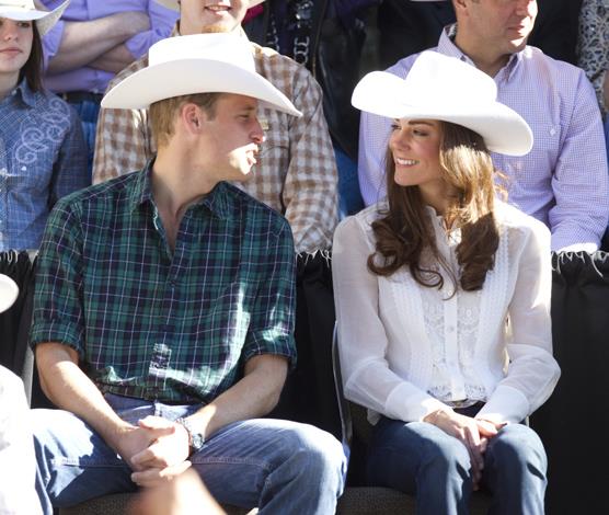 The down-to-earth pair wore matching cowboy hats as they watched the Calgary Stampede Parade in Calgary, Canada.