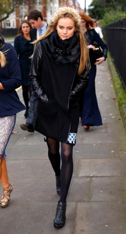 Cressida goes for an uber cool all black look at a friends wedding in December 2013.