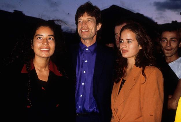 The Rolling Stones singer poses with his daughters Karis and Jade (R) in 1995 in Paris, France.
