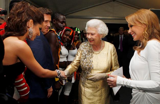 Queen Elizabeth II is introduced to Cheryl Cole by Kylie Minogue backstage after the Diamond Jubilee, Buckingham Palace Concert in June, 2012 in London.