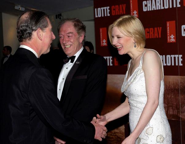 Cate Blanchett seemed tickled pink to meet Prince Charles at the premiere of *Charlotte Gray* in London, 2002.