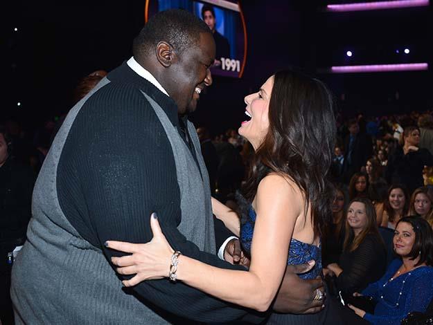 Sharing a giggle with The Blind Side co-star Quinton Aaron.