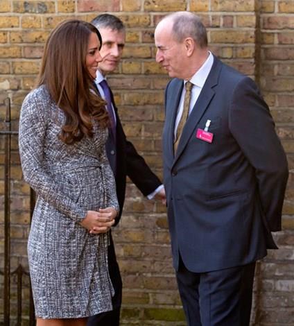 Kate showing off her growing bump in February last year.