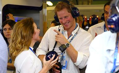Prince Harry laughs with Geri Halliwell at the Grand Prix