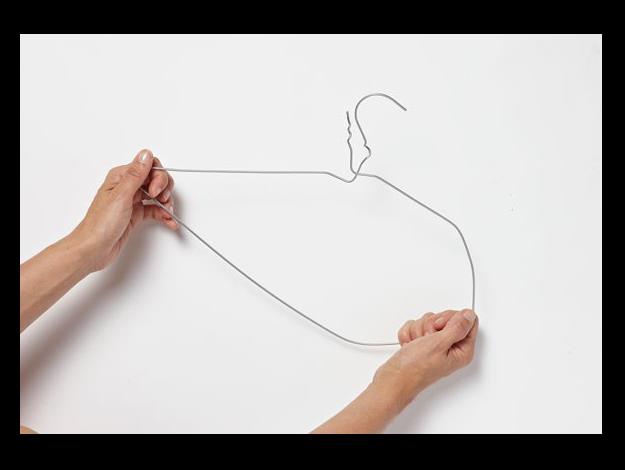 Take a simple metal clothes hanger and undo the shape to form a straight length. Shape the wire with your hands to form a circle – don't be too concerned with making a perfect round shape, the dodder vine will hide any imperfections. Twist the ring into itself and lock ends together.