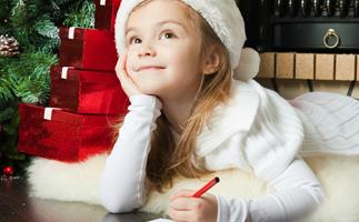 Little girl writing to Santa