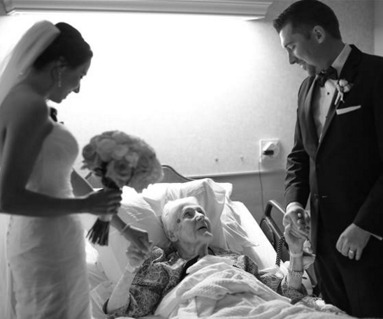Wedding couple visit grandma in hospital