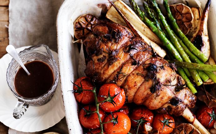 Roast lamb with anchovies, garlic and vegetables