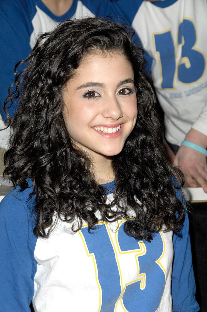 **October 2008**<br><br>

Age 15, a curly-haired Grande posed for a group photo, uncharacteristically showing off her right side. The singer reportedly only takes photos from her left side these days—we're guessing because that's the side with the dimple?