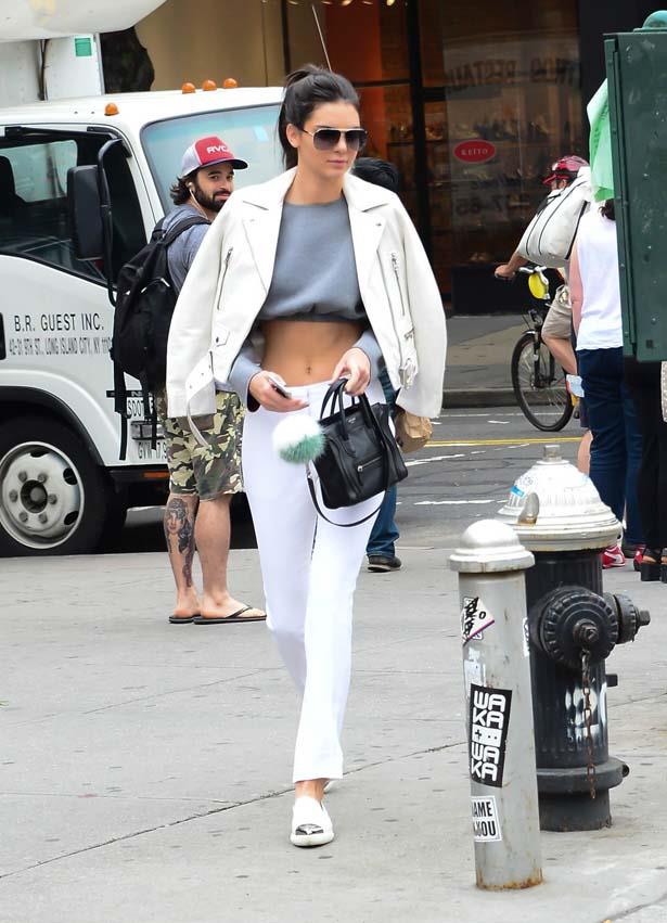 <p>June 16, 2015</p> <p>Kendall Jenner wears a white leather jacket while walking in Soho.</p>