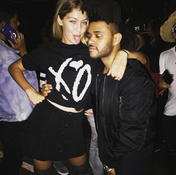 <p>4. She shares moments with her loved ones, here her older sister Gigi cuddles up with Bella's new boyfriend, the musician The Weeknd.</p>