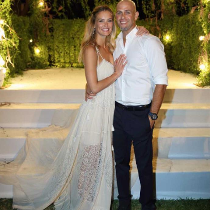 Bar Refaeli, the former Victoria's Secret model, looks beautiful in her sheer lace, laser-cut Chloé dress as she married Adi Ezra in her home country of Israel