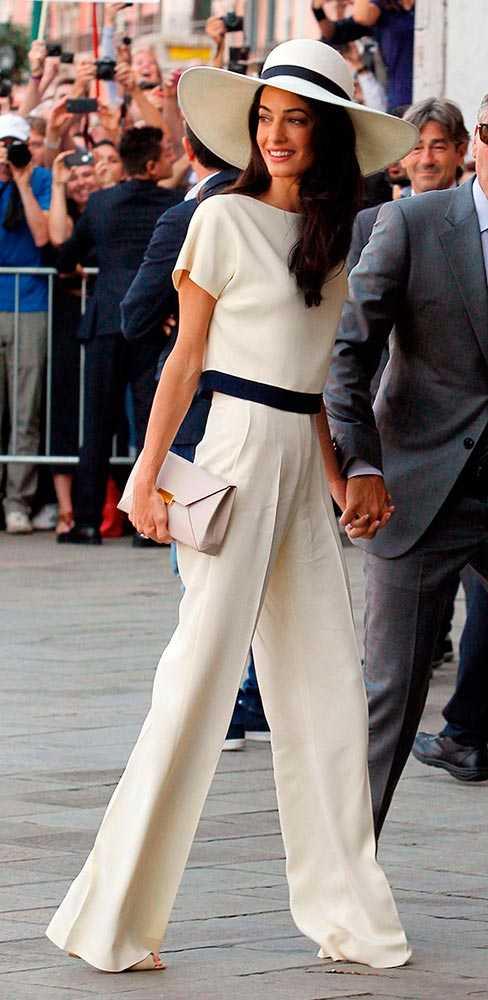 Sure, Amal Alamuddin wore Oscar de la Renta on her wedding day - but when she and Gorgeous George tied the knot for real, in a low-key civil ceremony, she did it in an ultra-chic cream trouser suit with matching wide-brimmed hat.