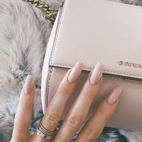 Kylie Jenner pioneered a new wave of dangerously impractical yet still cool nails, which are shaped into 'The Coffin' (right!).