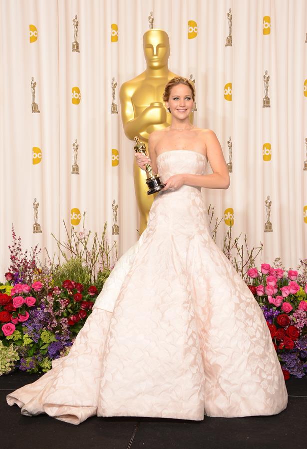 Jennifer Lawrence's white Dior gown was definitely a show-stopper - even though it tripped her up the stairs.