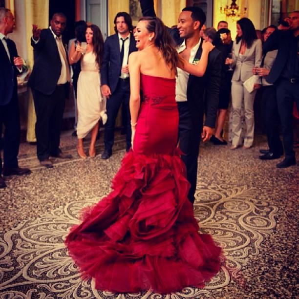 Chrissy Teigen went with this red dress for her reception.
