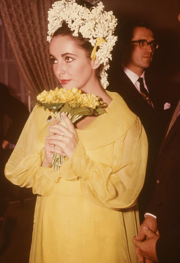 She also wore an unconventional dress to her first wedding to Richard Burton, this yellow shift complete with a flower head-piece.