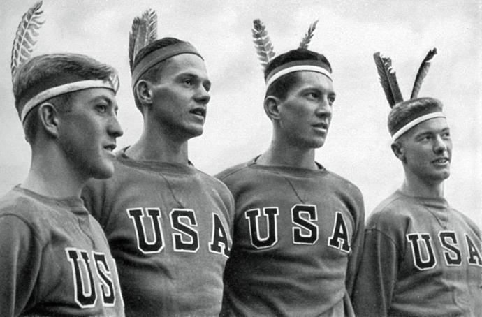 <p> <strong>1936</strong><p> <p> The American gold-medal-winning rowing team wearing headdresses in Berlin.