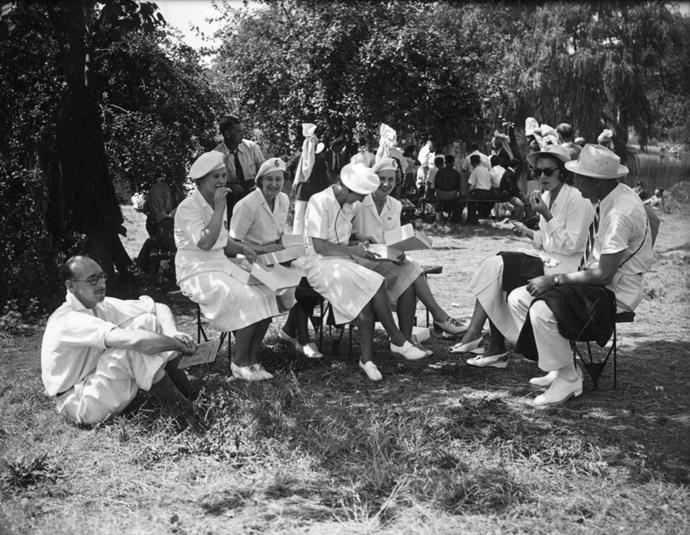 <p> <strong>1948</strong><p> <p> British Olympic women's fencing team having lunch on the lawn prior to the opening ceremony of the 1948 London Olympics. The A-line skirt becomes popular for women's female uniforms.