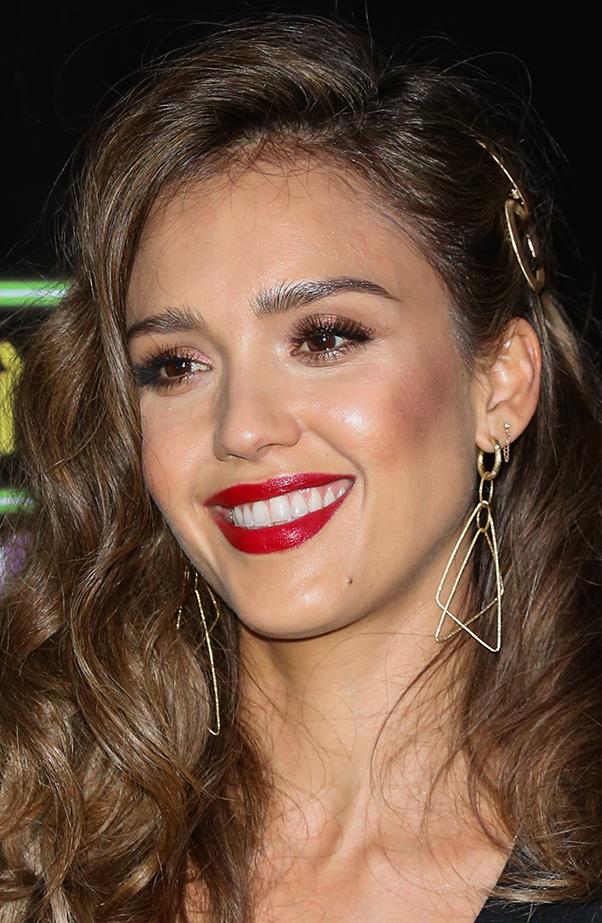 <p>Jessica Alba mixes it up with her double lobe piercings.