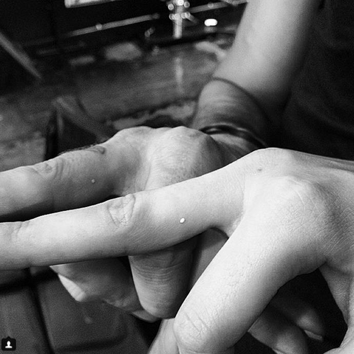 **Kendall Jenner and Hailey Bieber**
<br><br>
Kendall and Hailey also got these two tiny white ink dots on their fingers.