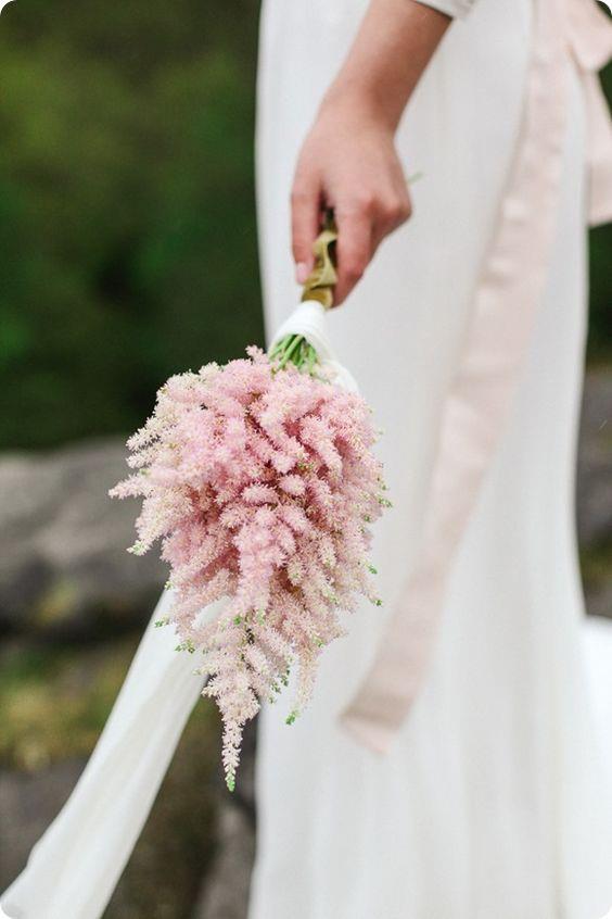 <p> <em>Astilbe</em><p> <p> Like baby's breath, astilbe has taken a supporting role in bouquets of late, but it's slowly coming into its own. Perfect for a simple posey, as opposed to a large bunch, astilbe (which is its prettier name, in contrast to 'false goat's beard') is delicate and dense.<p> <p> Image via <a href="https://au.pinterest.com/pin/409686897337297516/">Pinterest</a>.