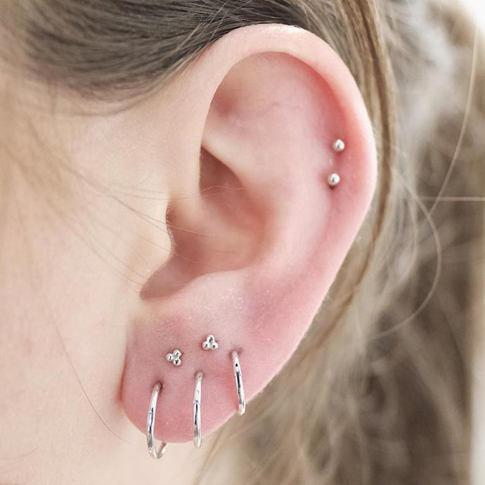 <p>This white gold cluster works because the lobes are large enough to fit all the piercings. <p><a href="https://www.instagram.com/p/BL02Aw3hSuA/" target="_blank">Instagram.com/bentauber</a>