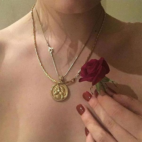 Religious-inspired gold pendants are having a serious moment. Layer with a gold chain for maximum impact<br><br> Image: Instagram <a href="https://www.instagram.com/p/BO12cO5D7-a/">@bitothisbitothat</a>