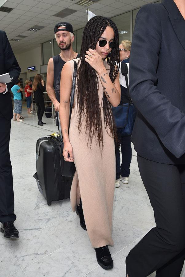 Kravitz elevates basics to new heights in this nude maxi dress paired with chunky black boots and shades.