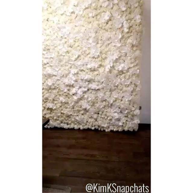 Behold, Kanye's Valetine's Day present to Kim, a wall made out of orchids and roses.