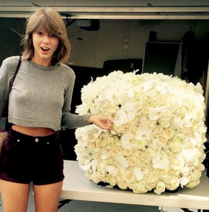 Taylor Swift is miraculously gifted with a flower cube? You don't fool us, Kanye, we know that a cube is just a wall folded into a little box.