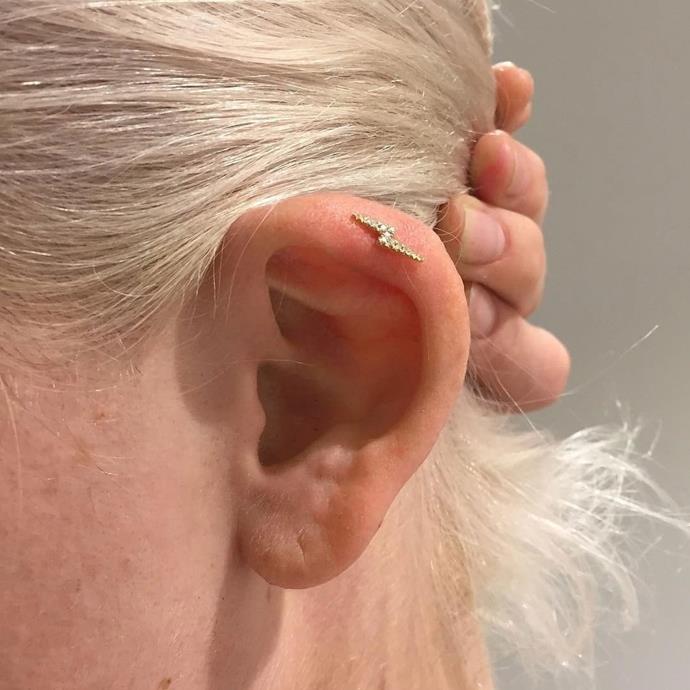 **HELIX FLAP PIERCING**<Br><br>

This is a cartilage piercing where the jewellery sits on the outside of the ear, as opposed to the inside. It's perfect for people whose ears fold over a little at the top.<br><br>

**Healing time:** 6 to 10 months.<br><br>

*Image via [@mariatash](https://www.instagram.com/p/BPfSWhGD20k/|target="_blank"|rel="nofollow")*