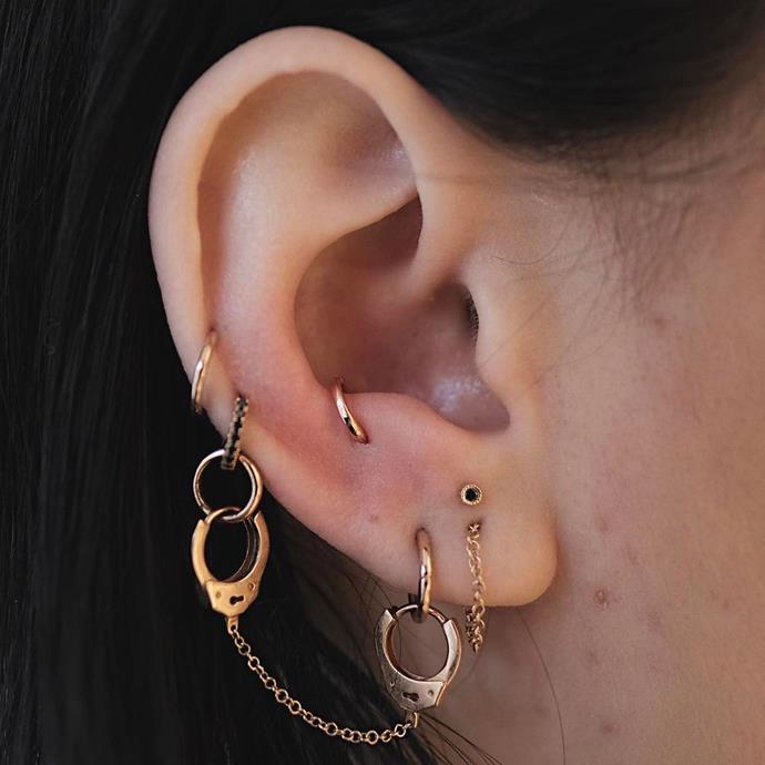This ear has a snug piercing, two cartilage piercings, and a cool stacked lobe situation.<br><br>

*Image via [@bentauber](https://www.instagram.com/p/BQDD-Z2BlWE/|target="_blank"|rel="nofollow")*