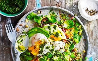 Breakfast salad with poached egg and kale pesto