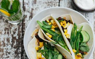 Chipotle bean tacos with pickled green beans and cucumber