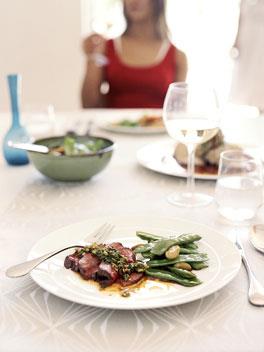 Stir-fried snowpeas with garlic (pictured with roast beef fillet with spring onion, ginger and coriander dressing)