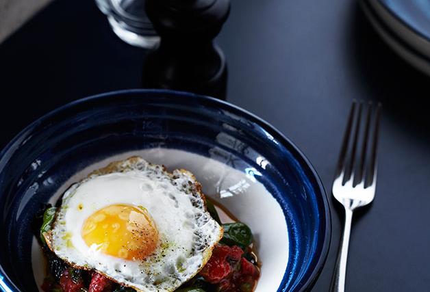 Wild greens, tomato sauce and fried egg
