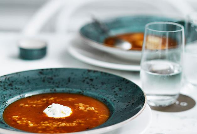Roast tomato soup with trahanas, Greek-style yoghurt and basil