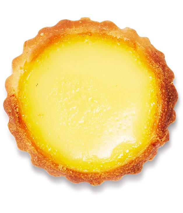 **Egg tart - daan**
One of the enduring treats of the Chinese bakery (and yum cha), the eggy and rich yet light egg tart, comes in both shortcrust and puff-pastry variants, both of which have avid fans. In either case, choose tarts that look smooth and consistent in colour across the top, with no sagging in the pastry. If you give the tart a gentle shake the filling should still wobble. For my money, the puff pastry trumps the short version, with the flakiness in the pastry contrasting nicely with the smooth custard. Eat as is, or dust with icing sugar and caramelise with a blowtorch to offset the sweetness.